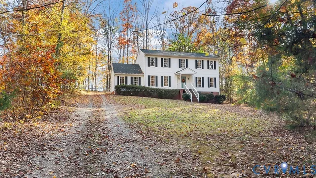 a view of residential houses with yard and swimming pool