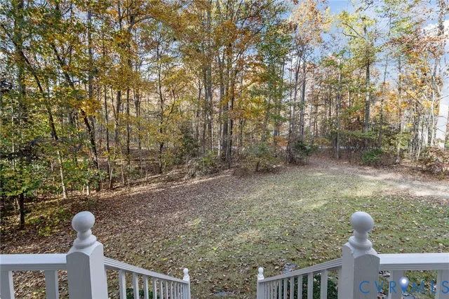 a view of balcony and yard
