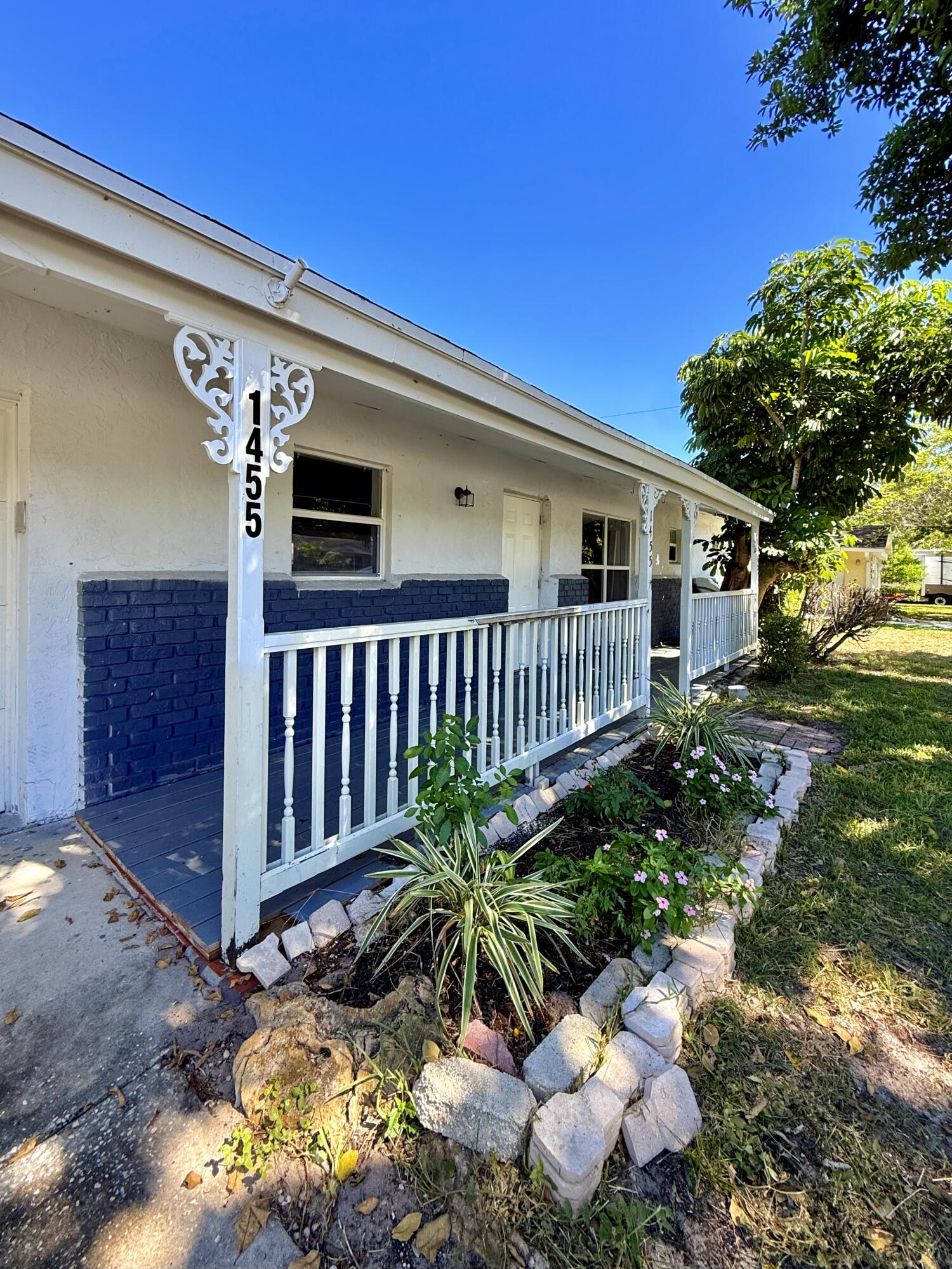 1455 Northeast Silver Maple Way Jensen Beach, FL 34957 - Photo 11 of 55 a view of a house with a yard