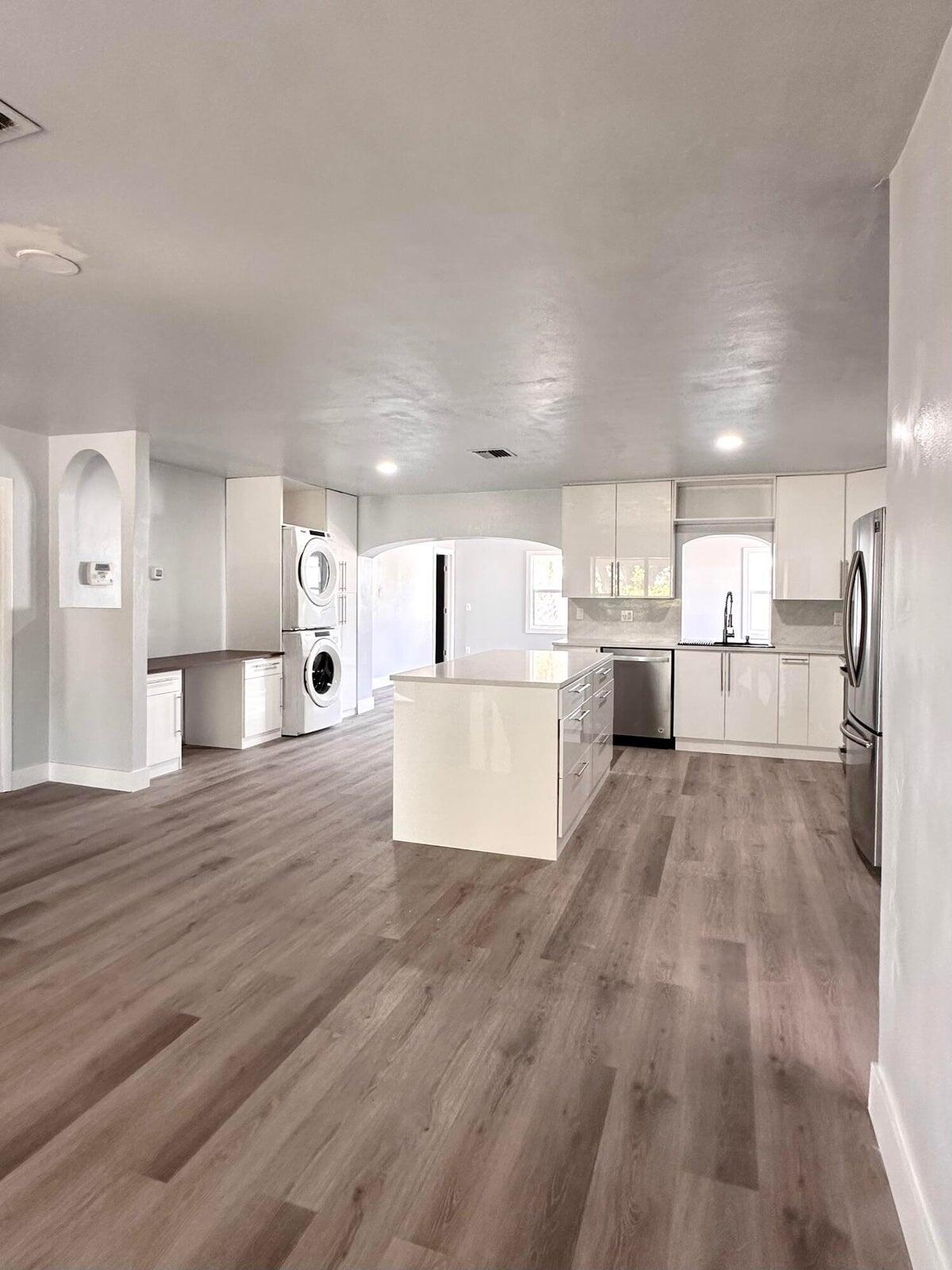 1455 Northeast Silver Maple Way Jensen Beach, FL 34957 - Photo 16 of 55 a view of kitchen and wooden floor