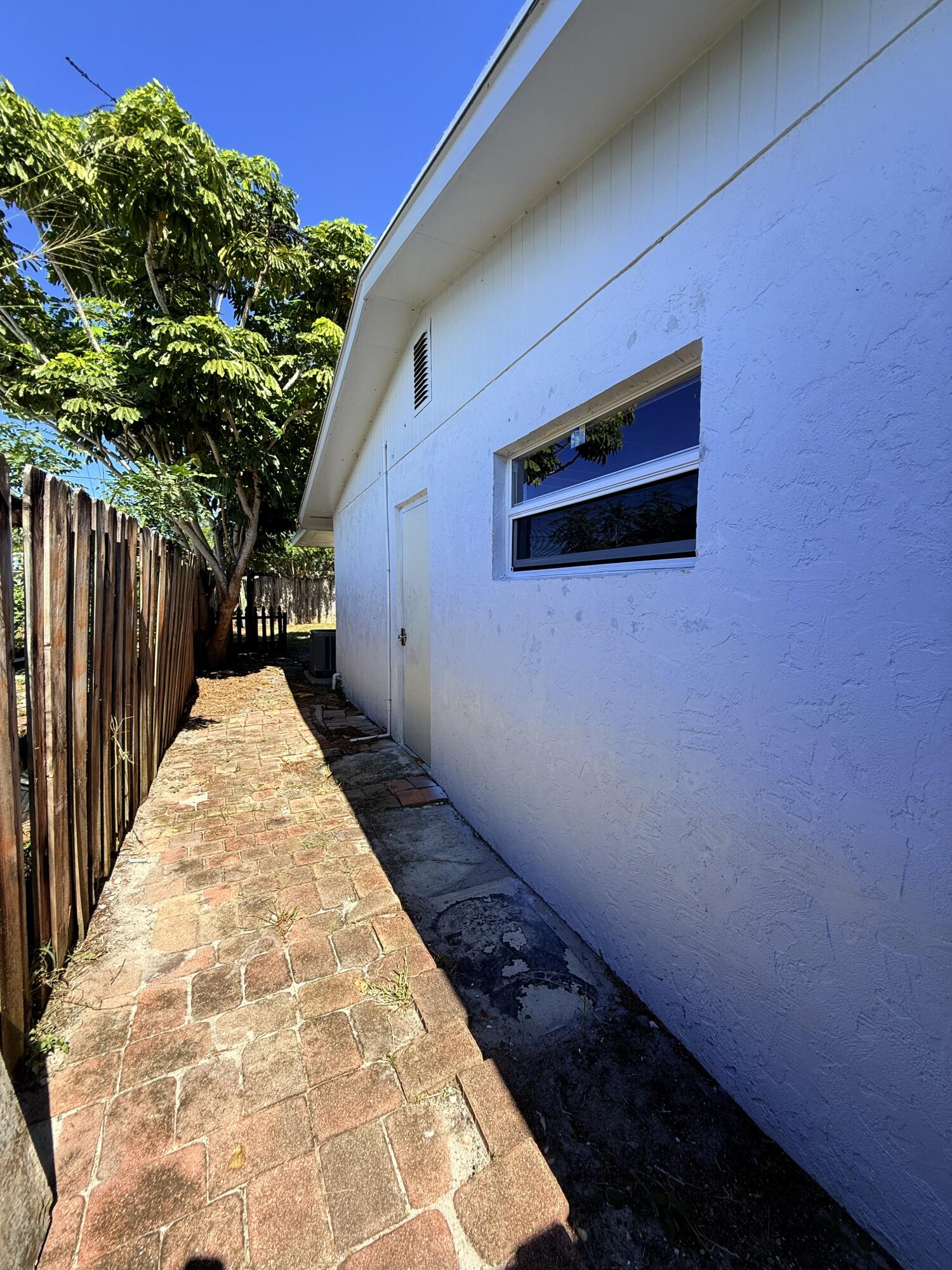 1455 Northeast Silver Maple Way Jensen Beach, FL 34957 - Photo 38 of 55 a view of a backyard