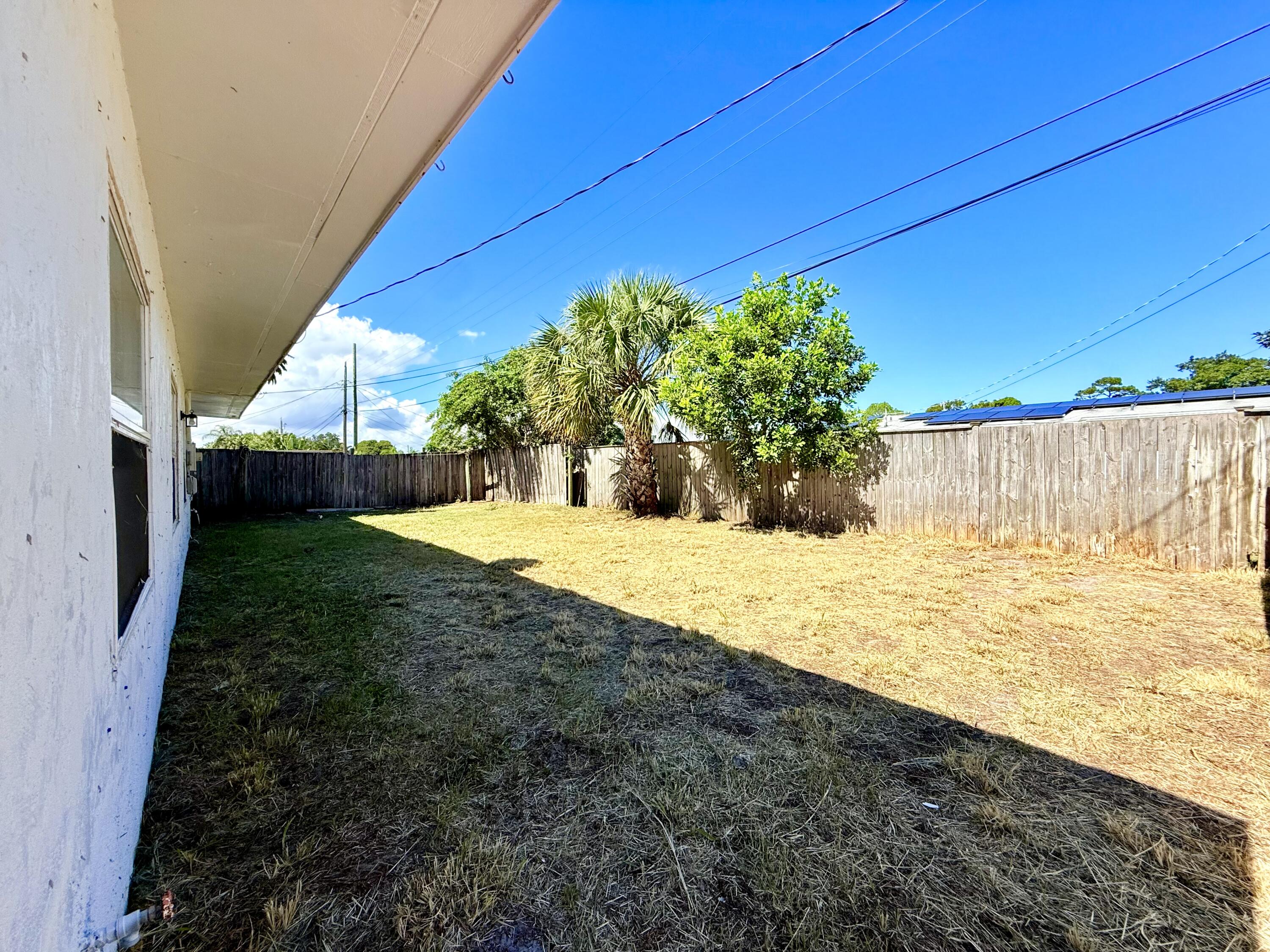 1455 Northeast Silver Maple Way Jensen Beach, FL 34957 - Photo 42 of 55 a view of backyard with green space