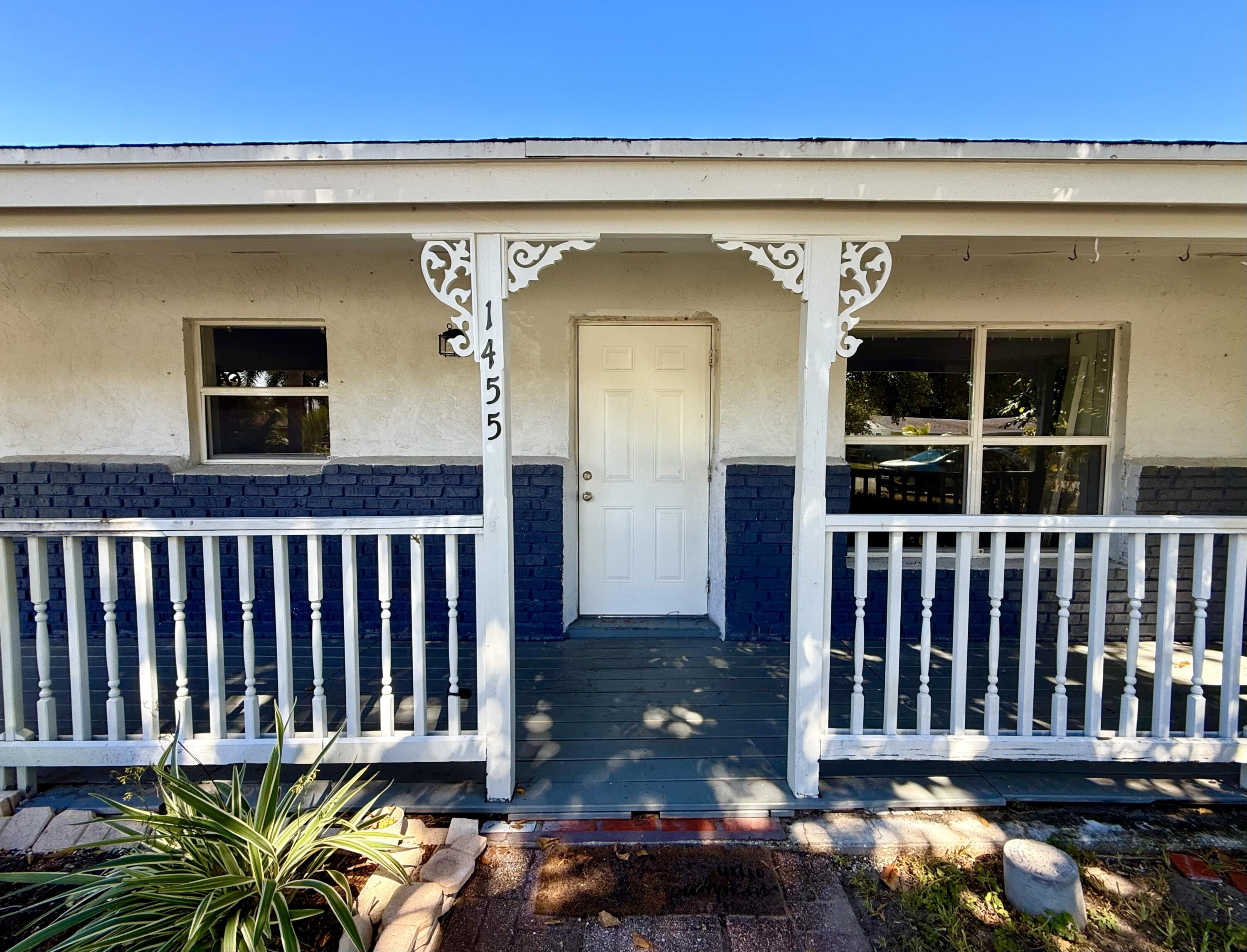 1455 Northeast Silver Maple Way Jensen Beach, FL 34957 - Photo 9 of 55 a view of a small house with wooden floor
