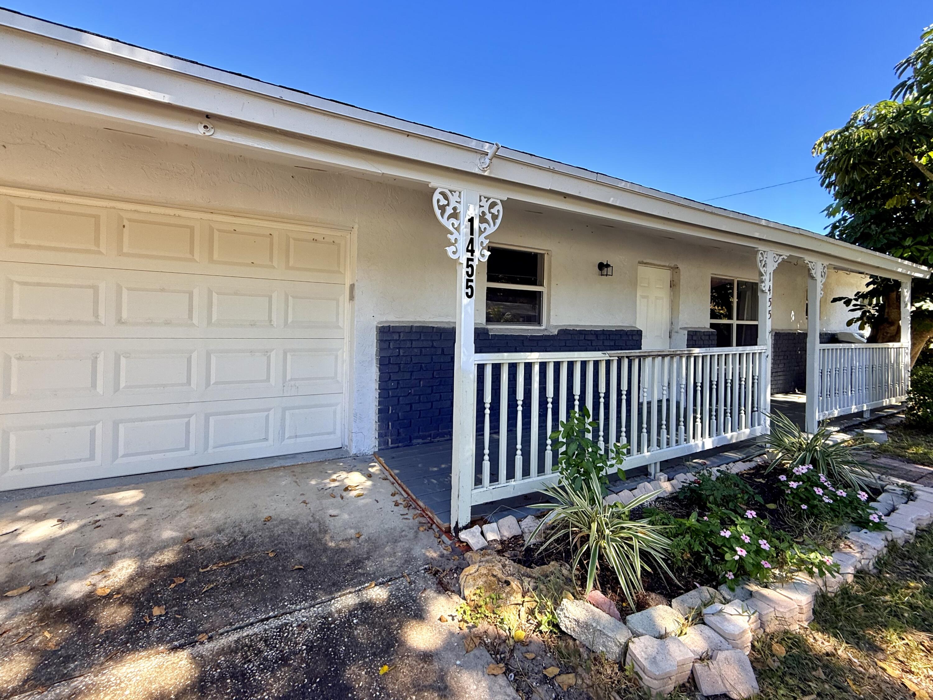 1455 Northeast Silver Maple Way Jensen Beach, FL 34957 - Photo 10 of 55 a view of a house with a backyard