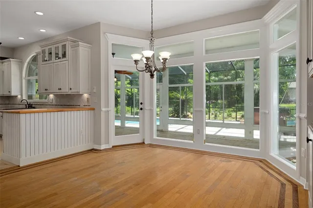 a kitchen with stainless steel appliances a refrigerator and a stove top oven