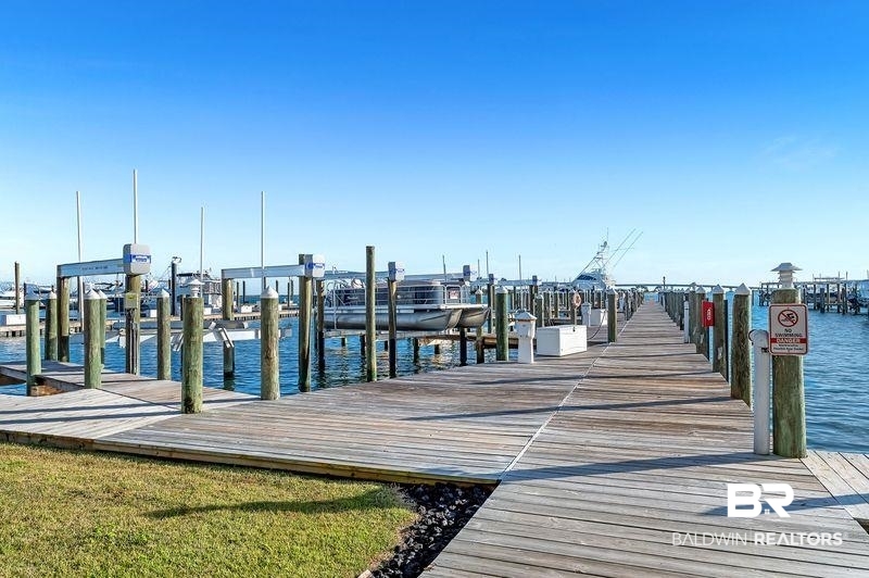 27800 Canal Road, Unit 411 Orange Beach, AL 36561 - Photo 39 of 49 Expansive marina featuring multiple wooden docks and boat slips