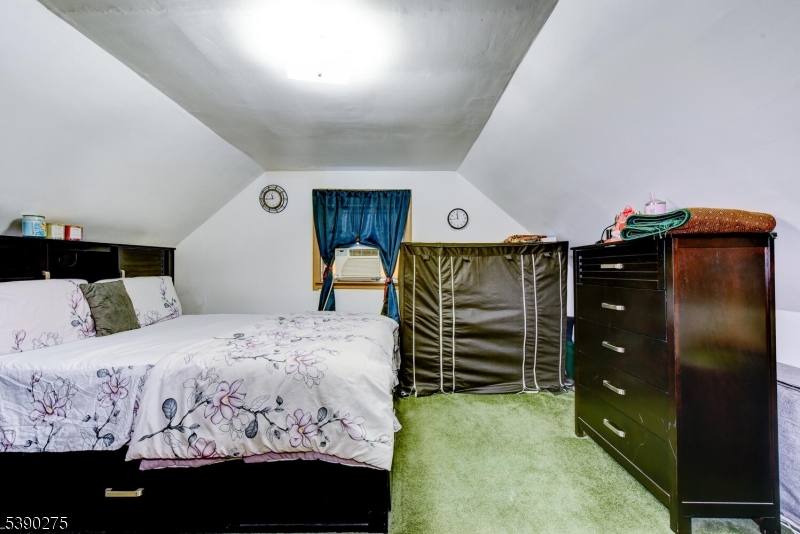 910 Wootton Street Boonton, NJ 07005 - Photo 12 of 21 a bedroom with a bed and a closet