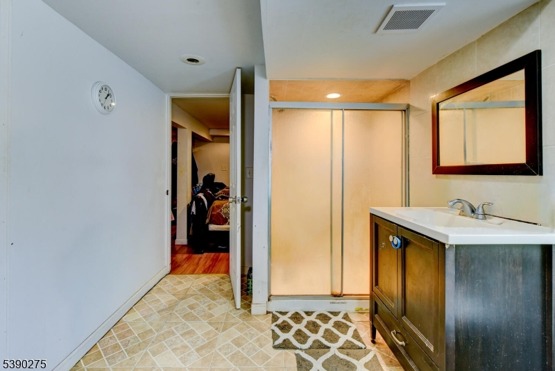 910 Wootton Street Boonton, NJ 07005 - Photo 17 of 21 a bathroom with a sink and a mirror
