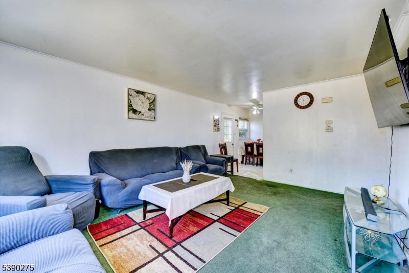 910 Wootton Street Boonton, NJ 07005 - Photo 3 of 21 a living room with furniture and a rug