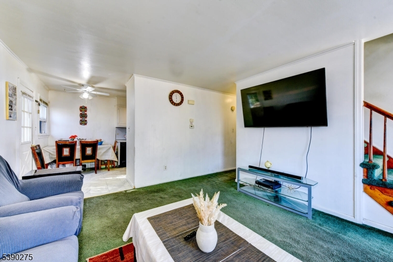 910 Wootton Street Boonton, NJ 07005 - Photo 4 of 21 a living room with furniture and a flat screen tv