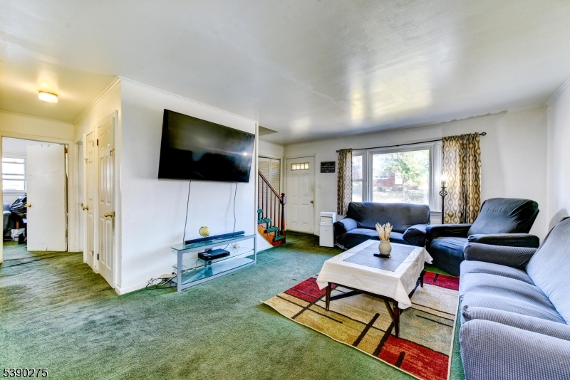 910 Wootton Street Boonton, NJ 07005 - Photo 5 of 21 a living room with furniture and a flat screen tv
