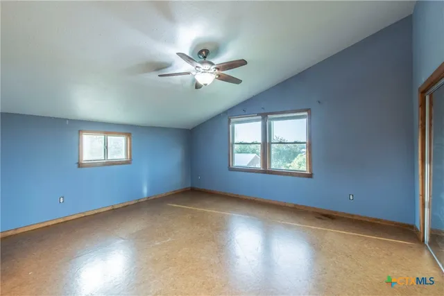 a view of a big room with windows