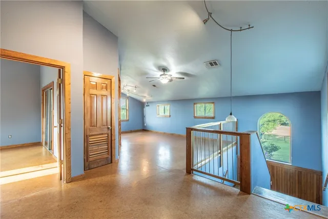 a view of livingroom with hardwood floor and a ceiling fan