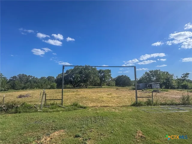 a view of a lake with a yard