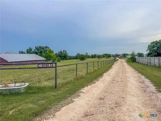 a view of a lake with a garden