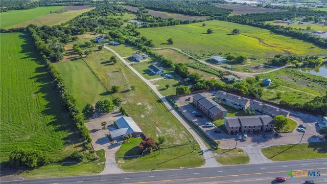 an aerial view of a house with outdoor space