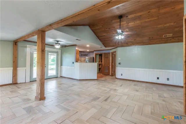 a view of a livingroom with a kitchen