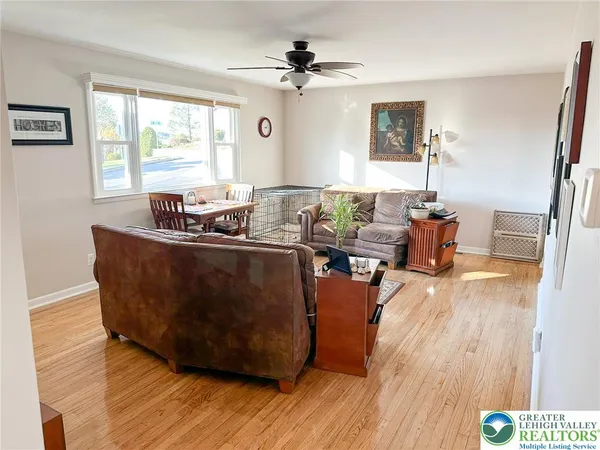 a kitchen with refrigerator and cabinets