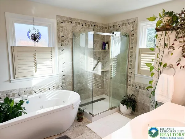 a bathroom with a sink vanity granite and a mirror