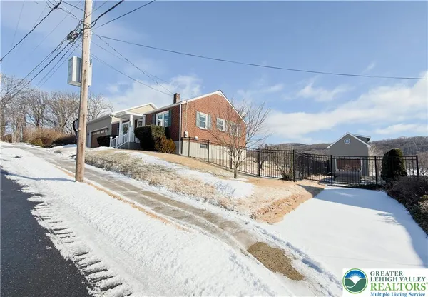 a view of a house with a snow