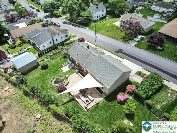 an aerial view of a house with a garden