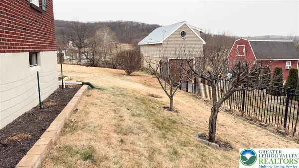 a view of a backyard of the house
