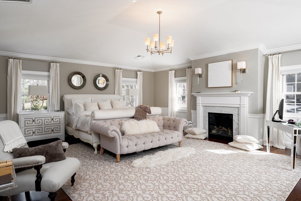 3 Brewer Way Hingham, MA 02043 - Photo 14 of 36 a spacious bedroom with a bed and a fireplace