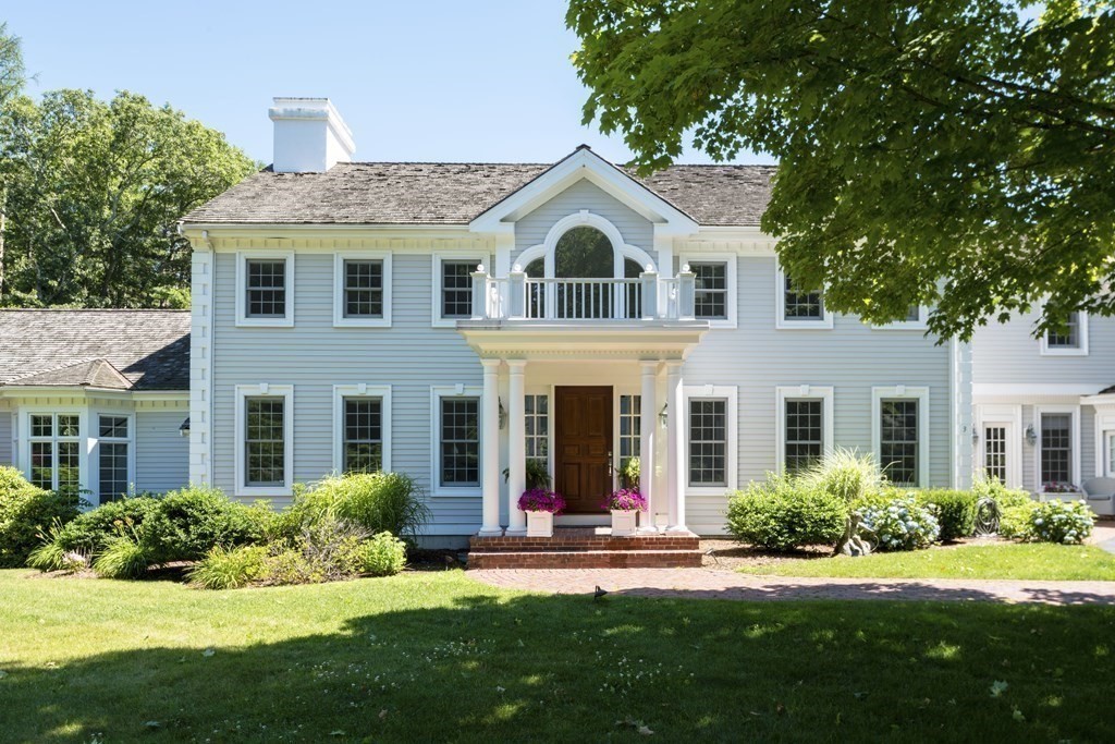 3 Brewer Way Hingham, MA 02043 - Photo 31 of 36 a view of a white house with a yard table and chairs