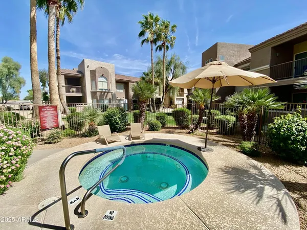 a view of a swimming pool with a patio