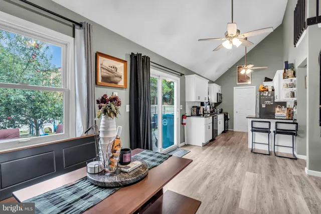 a kitchen with a table and chairs