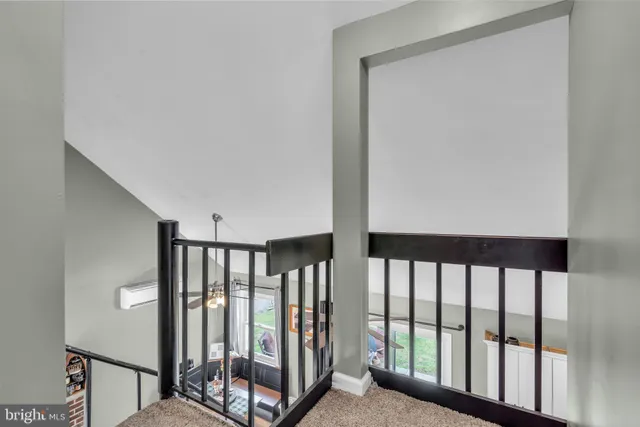 a view of a porch with wooden floor and windows