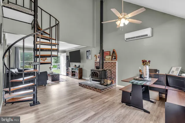 a work room with furniture and wooden floor