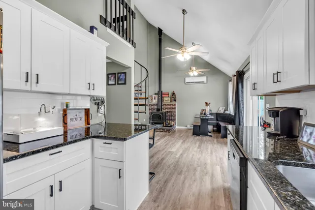 a kitchen with sink cabinets and appliances