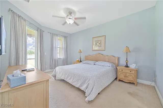 a bedroom with bed and window