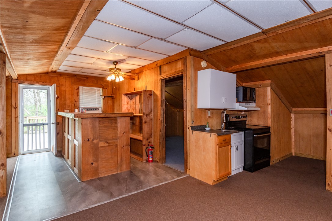 6750 Little Twin Road Germantown, OH 45327 - Photo 60 of 88 This versatile space features knotty pine paneling, an efficient kitchen, and direct access to outdoor living.