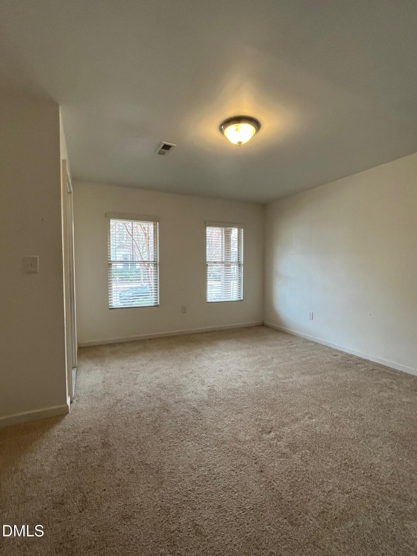 1517 Crafton Way Raleigh, NC 27607 - Photo 3 of 28 an empty room with windows