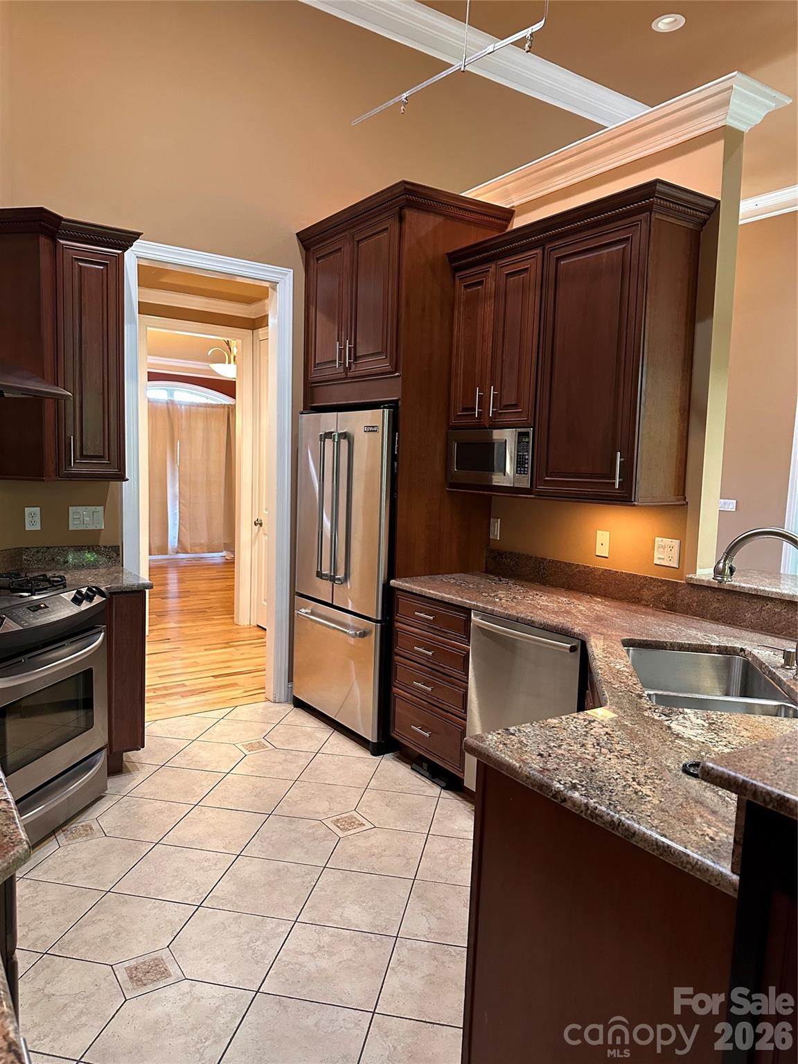 26 Stone House Road Arden, NC 28704 - Photo 10 of 21 a kitchen with stainless steel appliances granite countertop a refrigerator and a stove top oven