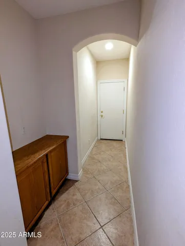 a view of a house with a tree in front of main door