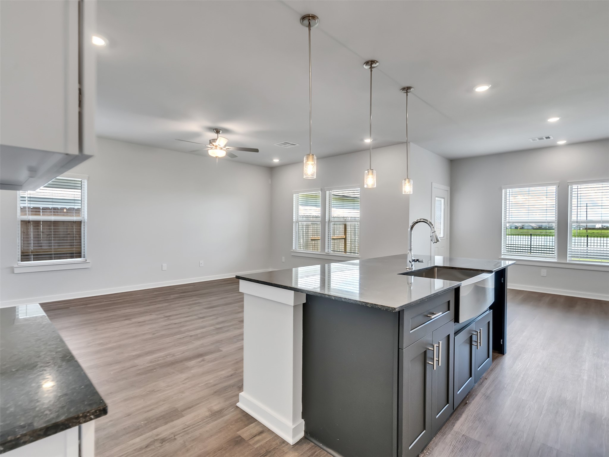 1206 Elsinore Drive Rosharon, TX 77583 - Photo 8 of 21 a kitchen with kitchen island a sink appliances and a counter top space