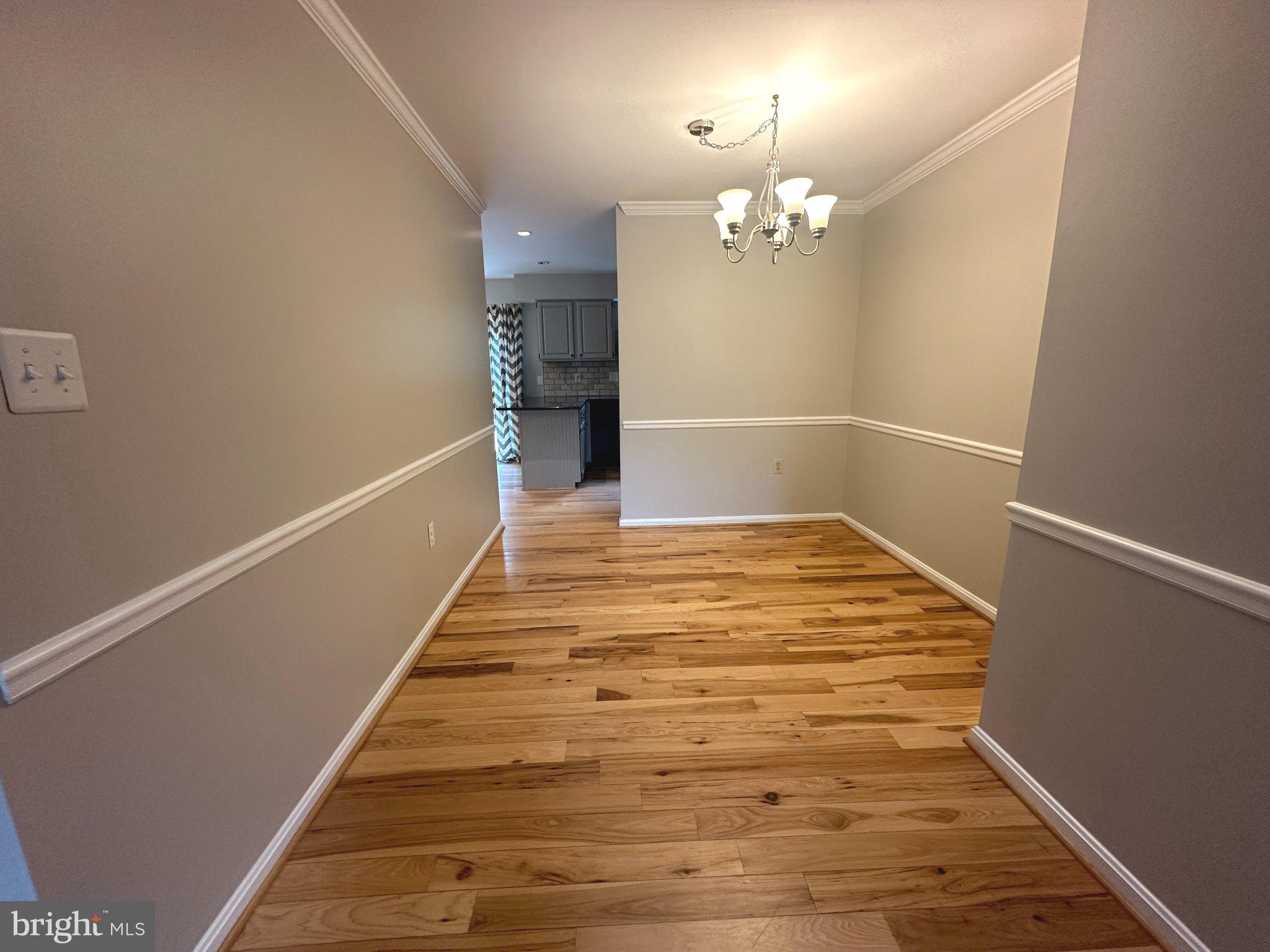 11928 Sentinel Point Court Reston, VA 20191 - Photo 7 of 23 Inviting hallway with elegant charm.
