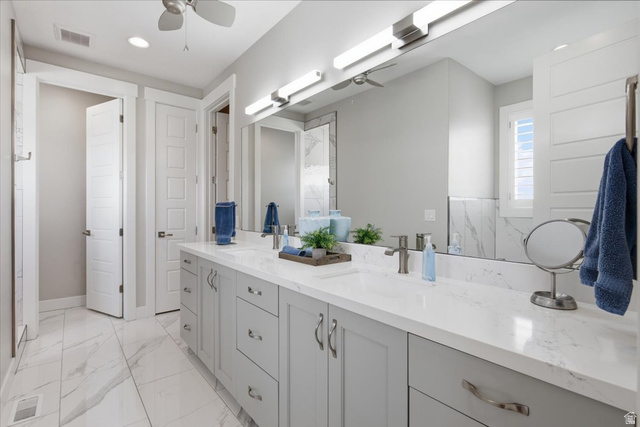 21 Pier Place Tooele, UT 84074 - Photo 35 of 112 Dual vanity with light gray cabinetry and white countertops