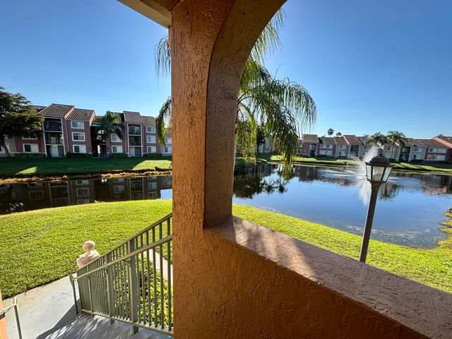 a view of a lake with a yard