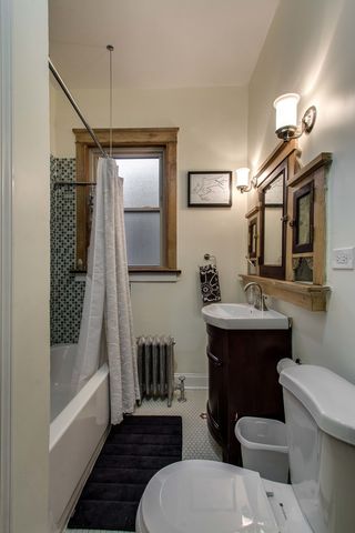 a bathroom with a sink toilet tub and shower