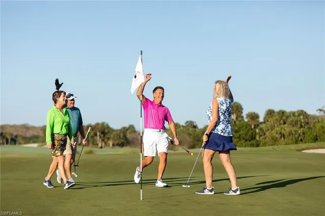 a view of swimming pool with seating area