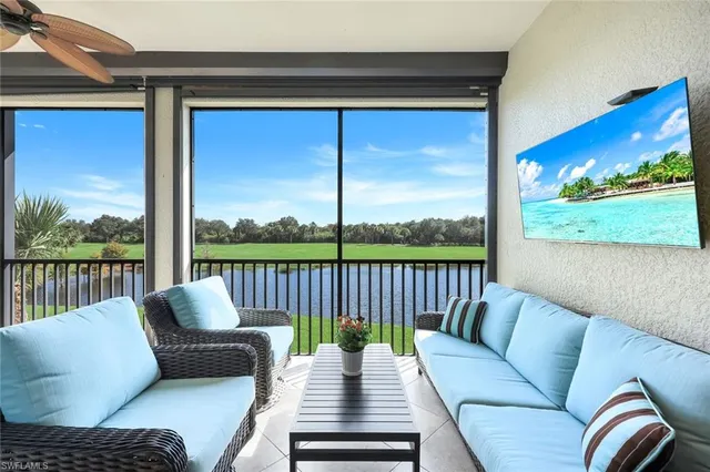 a balcony view with a couch and wooden floor