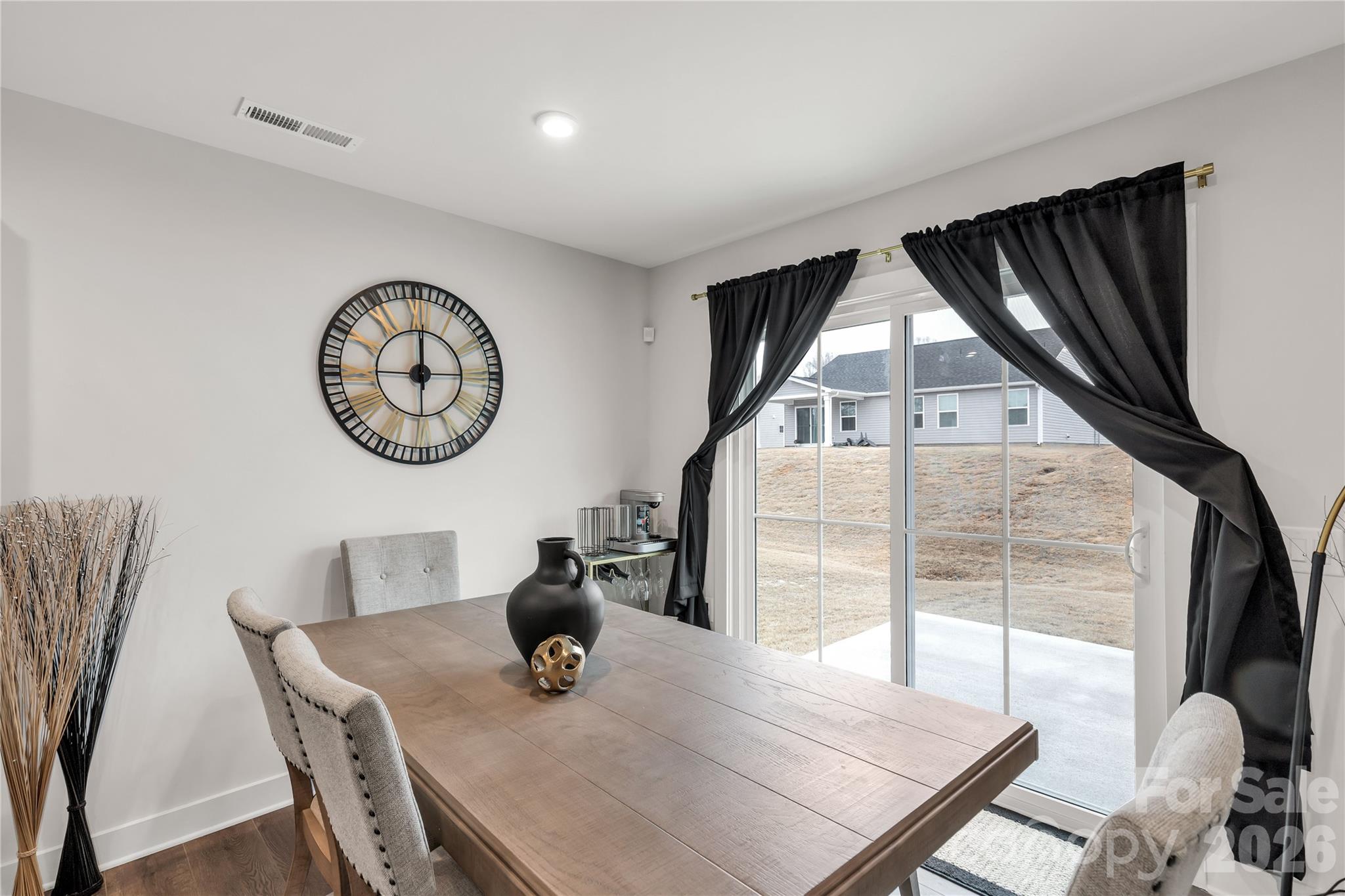 810 Purslane Street Lancaster, SC 29720 - Photo 11 of 24 a view of a dining room with furniture window and wooden floor