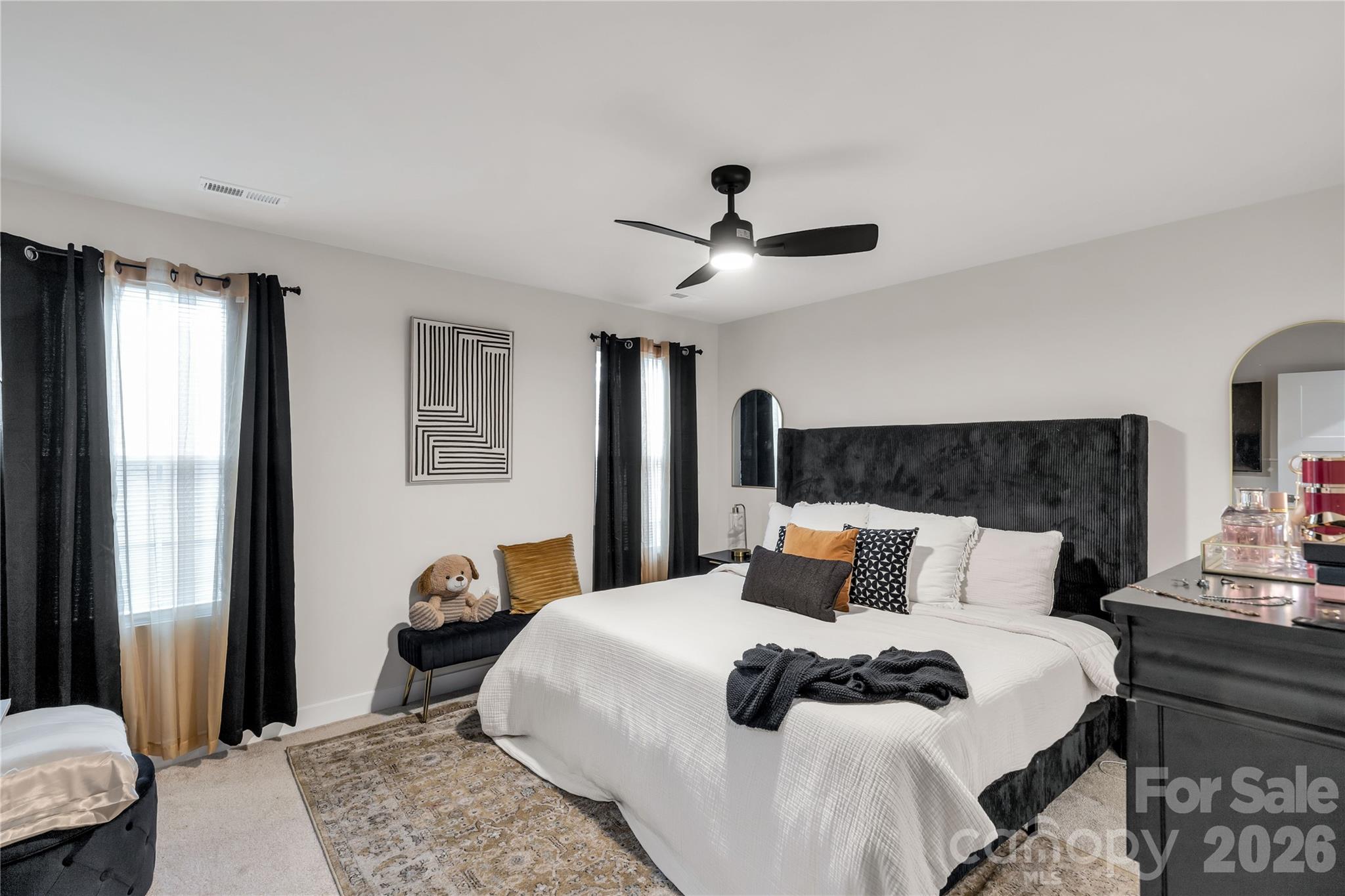 810 Purslane Street Lancaster, SC 29720 - Photo 14 of 24 a bedroom with a bed a lamp and a window