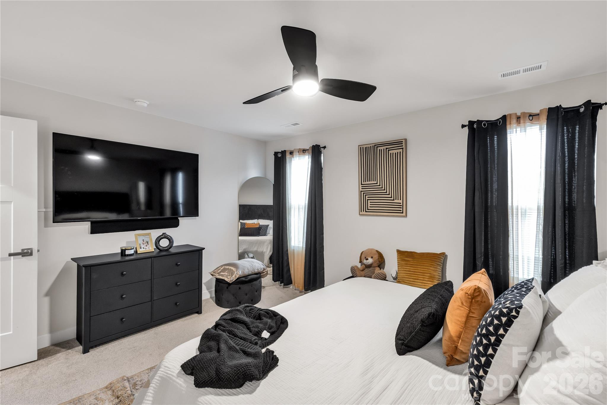 810 Purslane Street Lancaster, SC 29720 - Photo 15 of 24 a bedroom with a bed and a flat screen tv