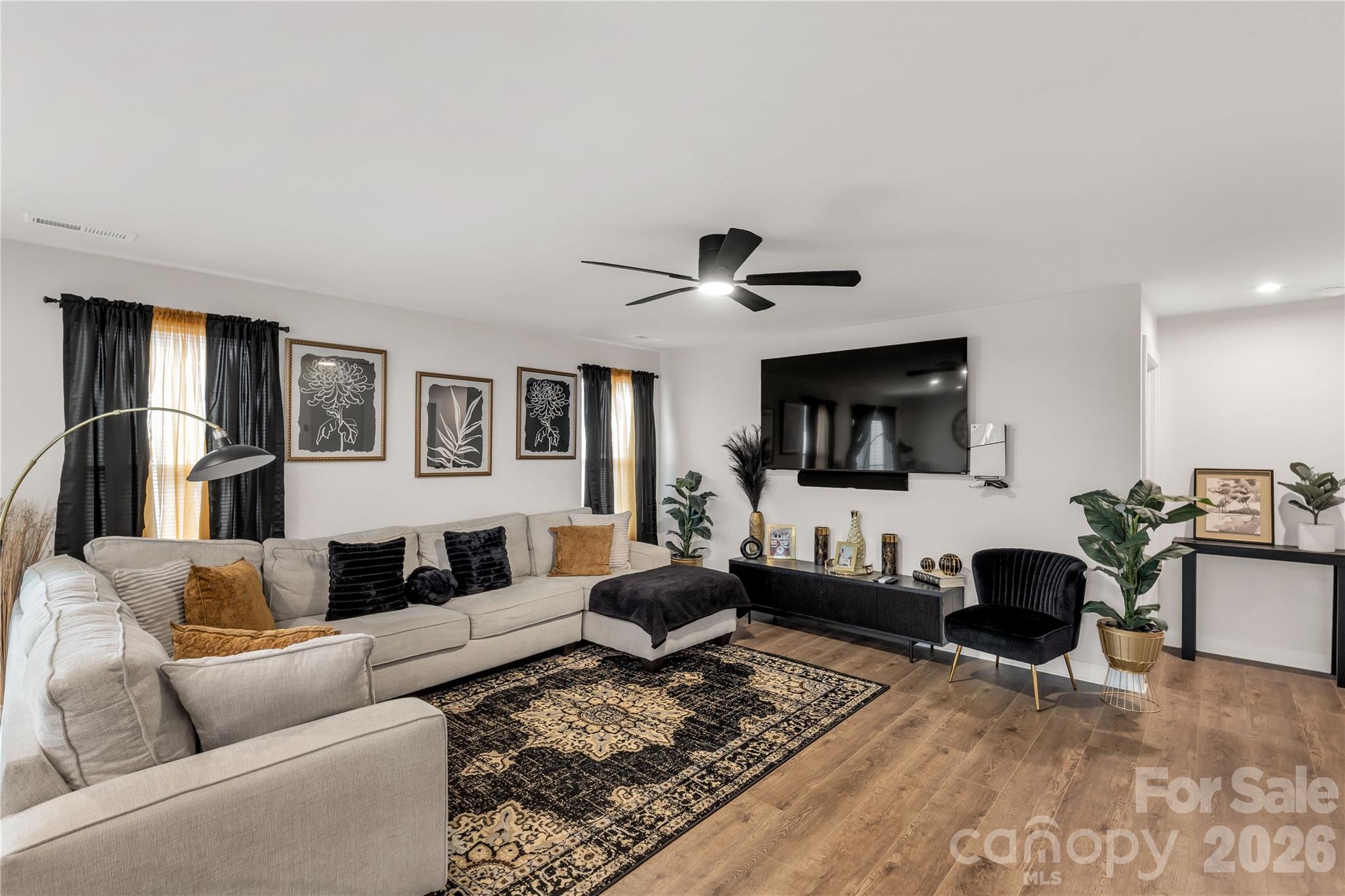 810 Purslane Street Lancaster, SC 29720 - Photo 5 of 24 a living room with furniture and a ceiling fan