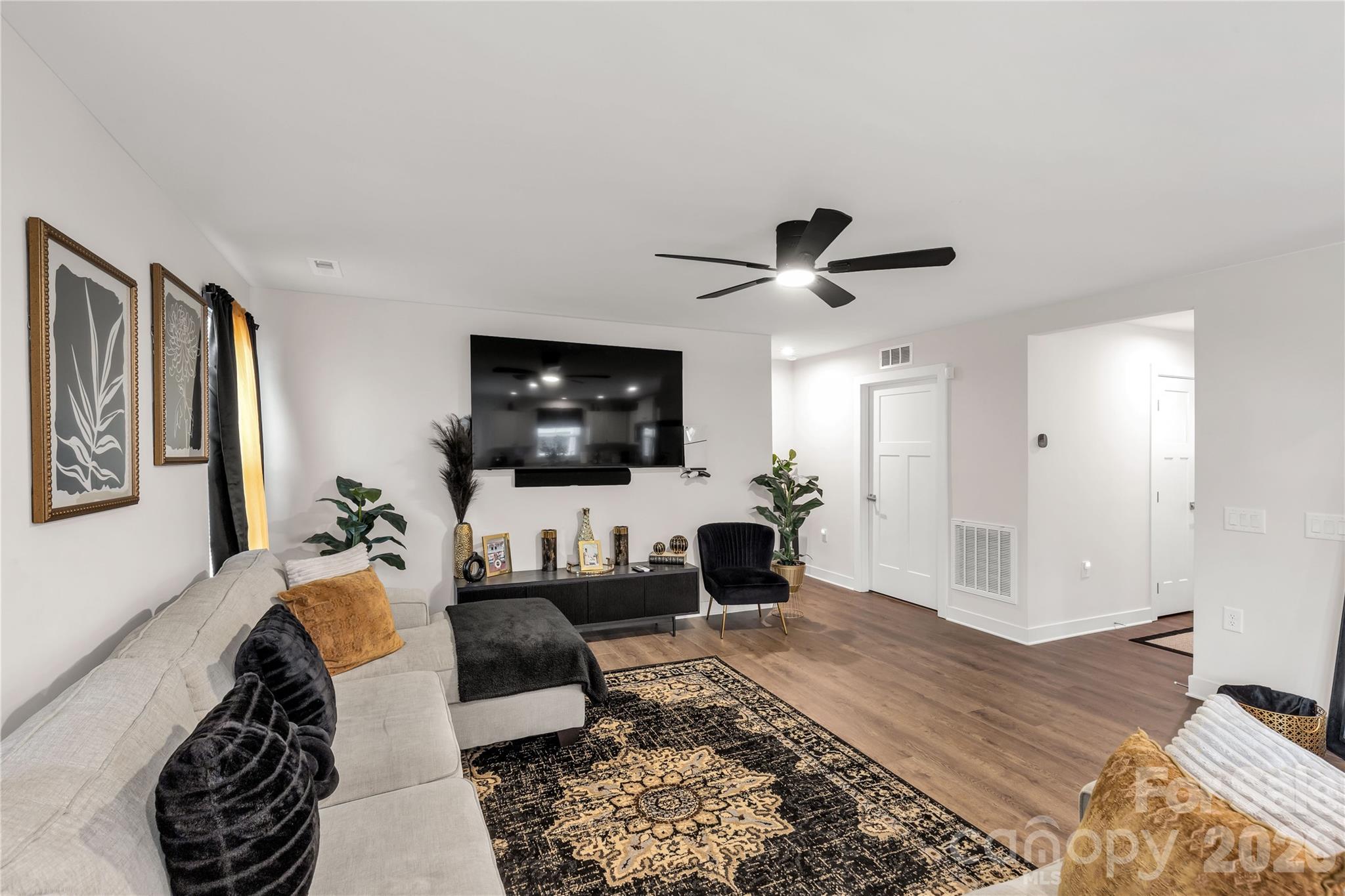810 Purslane Street Lancaster, SC 29720 - Photo 6 of 24 a living room with furniture and a flat screen tv